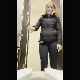 A blonde girl wearing a mask records herself pissing and taking a firm shit while sitting on the edge of a toilet in a public restroom. She wipes when finished. Vertical format video. About a minute.